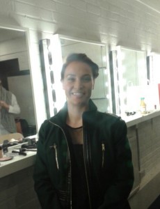 Girl in front of make up mirrors