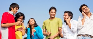 Indian Friends People Talking on cell phones SMS Having Fun
